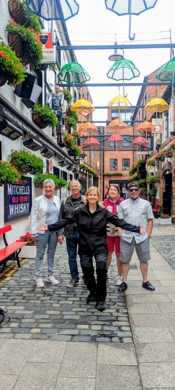 Lucie leading a private walking tour group in Belfast's Commercial Court